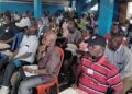 A cross-section of University of Liberia faculty members seated during a meeting on the Capitol Hill campus to discuss the ongoing strike and negotiations with the government and administration.