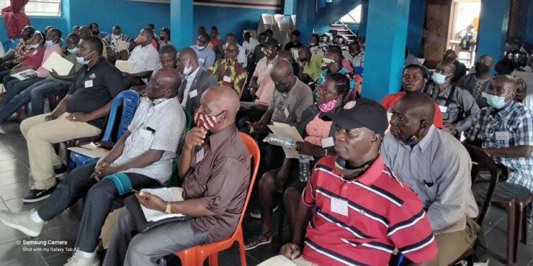 A cross-section of University of Liberia faculty members seated during a meeting on the Capitol Hill campus to discuss the ongoing strike and negotiations with the government and administration.