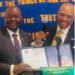 Liberian Ambassador Dr. Al-Hassan Conteh receives Honorary Membership certificate from Washington DC Rotary Club President Donnie Shaw