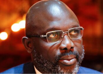 George Weah during his presidency, criticized for failing to implement Liberia’s National Sports Policy
