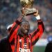 George Weah celebrates Ballon d’Or victory in AC Milan shirt.