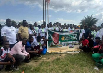 Group of Bong County students pose with a banner at the launch of William Telebo Thompson’s 5th Student Internship Program in Totota