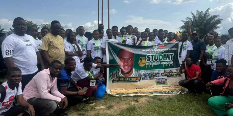 Group of Bong County students pose with a banner at the launch of William Telebo Thompson’s 5th Student Internship Program in Totota