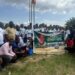 Group of Bong County students pose with a banner at the launch of William Telebo Thompson’s 5th Student Internship Program in Totota