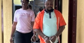 Defendant Bill Jallah being escorted from Criminal Court ‘B’ in Monrovia after being convicted of murdering his girlfriend, Princess Zuo Wesseh, in Paynesville