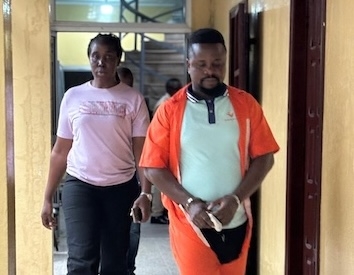 Defendant Bill Jallah being escorted from Criminal Court ‘B’ in Monrovia after being convicted of murdering his girlfriend, Princess Zuo Wesseh, in Paynesville