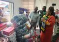 ECOWAS Resident Representative Josephine Nkrumah presenting humanitarian donations during ECOWAS’s 50th anniversary celebration in Monrovia, Liberia.
