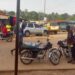 Motorcycles and riders on a busy street in Gbarnga, Bong County, where police have imposed a late-night travel ban to curb rising robberies.