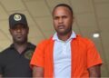 Nigerian national Michael Oputa in handcuffs after being sentenced to five years for piracy in Liberia
