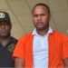 Nigerian national Michael Oputa in handcuffs after being sentenced to five years for piracy in Liberia