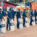 Liberia National Police officers in riot gear stand in formation after arresting six individuals linked to a protest in Ganta, Nimba County.