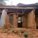 Collapsed mud-brick structure of Gbarn-la Public School in Bong County, Liberia, leaving over 500 children without access to education