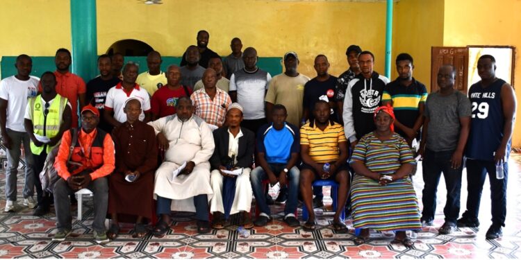 Group photo of taxpayers, community leaders, and LRA officials during a tax-education town-hall session in western Liberia.