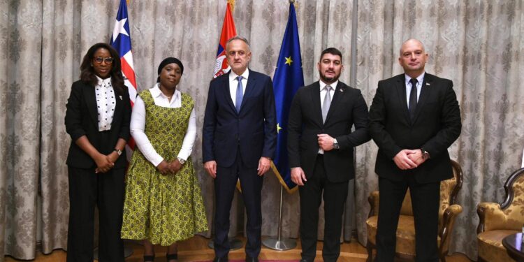 Liberian Foreign Minister Sara Beysolow Nyanti and Serbian officials pose after signing a strategic football cooperation deal aimed at reviving the Lone Star