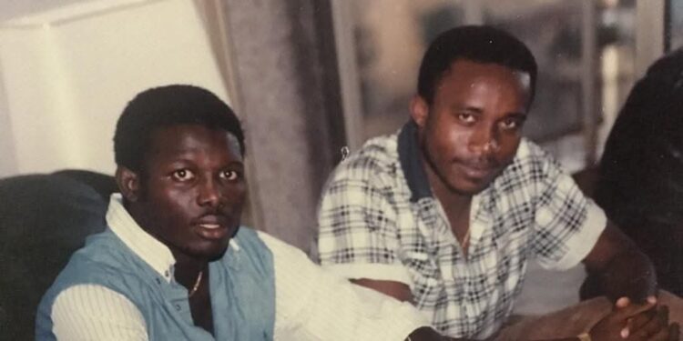 A young Mohamed Koneh (left) and journalist Omari Jackson (right) in the 1980s, discussing the move that would launch George Weah’s football career in Cameroon.