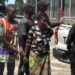 LDEA officers escort 70-year-old Lucy Morris and other suspects after kush bust in West Point, Monrovia
