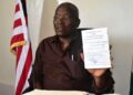 Grand Gedeh County officials and investor Boubou Sebu during the signing of a 30-year cocoa land lease agreement in Zwedru, Liberia.