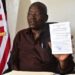 Grand Gedeh County officials and investor Boubou Sebu during the signing of a 30-year cocoa land lease agreement in Zwedru, Liberia.
