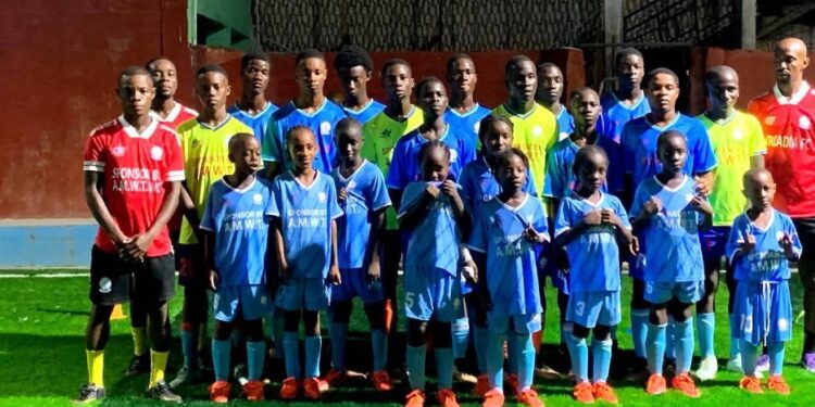 Young players and coaches of Arcadia Soccer Academy in Brewerville pose for a group photo after training at the academy’s G-4 Community pitch.
