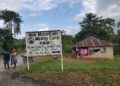 A road sign for Bea Mountain Mining Corporation (BMMC) near Kinjor, Grand Cape Mount County, amid reports the company denied hiring expatriates as car washers
