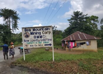 A road sign for Bea Mountain Mining Corporation (BMMC) near Kinjor, Grand Cape Mount County, amid reports the company denied hiring expatriates as car washers
