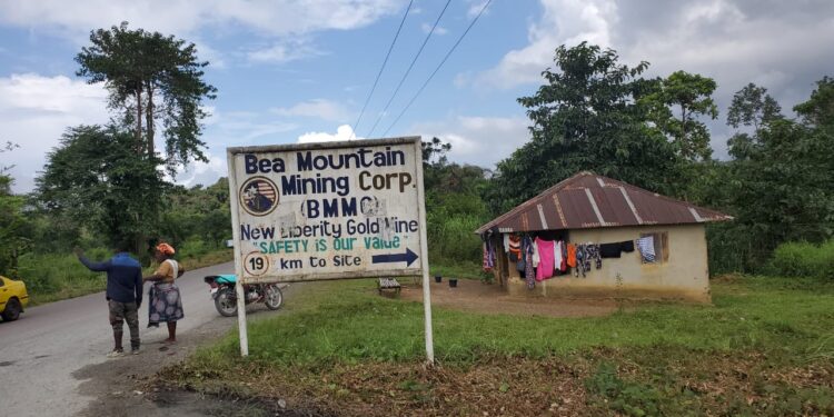 A road sign for Bea Mountain Mining Corporation (BMMC) near Kinjor, Grand Cape Mount County, amid reports the company denied hiring expatriates as car washers