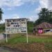 A road sign for Bea Mountain Mining Corporation (BMMC) near Kinjor, Grand Cape Mount County, amid reports the company denied hiring expatriates as car washers