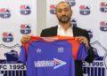 Belgian coach Alain-André Landeut holds a LISCR FC jersey during his unveiling ceremony before resigning after two months in charge of the Liberian club.