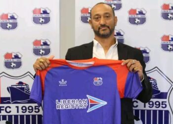 Belgian coach Alain-André Landeut holds a LISCR FC jersey during his unveiling ceremony before resigning after two months in charge of the Liberian club.