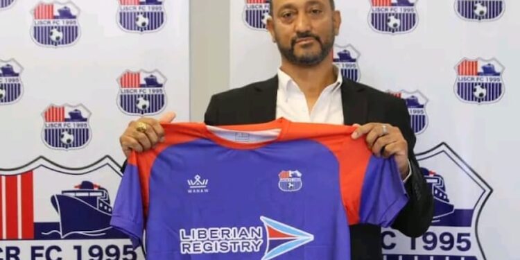 Belgian coach Alain-André Landeut holds a LISCR FC jersey during his unveiling ceremony before resigning after two months in charge of the Liberian club.