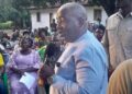 CMC political leader Musa Bility speaks to Bong County residents during the groundbreaking of a $500,000 Jor River bridge project, challenging Senator Prince Moye to deliver on road construction