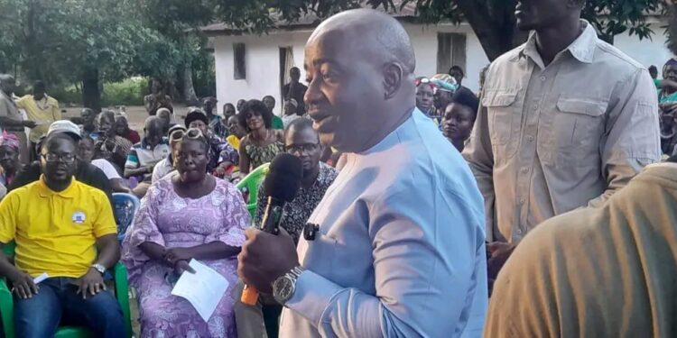 CMC political leader Musa Bility speaks to Bong County residents during the groundbreaking of a $500,000 Jor River bridge project, challenging Senator Prince Moye to deliver on road construction