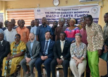 British Chargé d’Affaires Simon Tooth and Liberian justice advocates pose with civil society leaders at the launch of the Abolition of the Death Penalty Project in Monrovia.