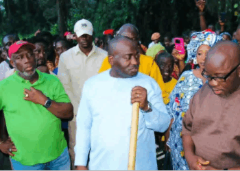 Citizens Movement for Change leader Musa Hassan Bility visits the halted bridge construction site in Gbarnga, Bong County, amid controversy over the government’s suspension order.