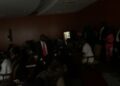 Lawmakers at Liberia’s Capitol Hill chamber sit in partial darkness during a 30-minute power outage as House Chair James Kolleh coordinates restoration efforts