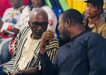 Unity Party Chairman Rev. Luther Tarpeh speaks with ANC Political Leader Alexander Cummings during the ANC National Convention in Margibi County, calling for political cooperation to support Liberia’s progress.