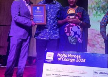 Den-Vera Medical Laboratory and Clinic founders receiving the 2025 Lonestar Cell MTN MoMo Heroes of Change Award with a symbolic cheque for LRD 1.5 million in Monrovia