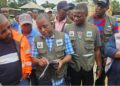 EPA Executives inspect containers during the probe into Elsin Transport’s alleged unauthorized disposal of palm-kernel shells in Paynesville.