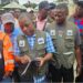 EPA Executives inspect containers during the probe into Elsin Transport’s alleged unauthorized disposal of palm-kernel shells in Paynesville.