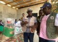 Liberian Agriculture Minister Dr. J. Alexander Nuetah unveils the Gbedin Rice brand and opens the 2025 national rice harvest in Sehyikepa, Nimba County, to boost local production and cut rice imports