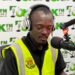 Labour rights advocate George S. Tengbeh of LILGA speaks during a radio interview after receiving death threats for exposing workplace abuses in Liberia