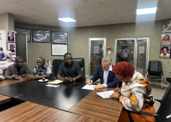 Officials of APM Terminals Liberia and the Dock Workers Union sign a new Collective Bargaining Agreement at the National Port Authority in Monrovia.