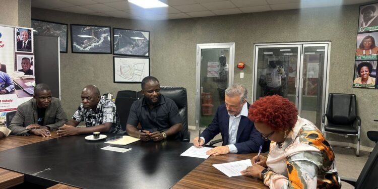 Officials of APM Terminals Liberia and the Dock Workers Union sign a new Collective Bargaining Agreement at the National Port Authority in Monrovia.