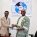 LSEZA Executive Chairman Prince Wreh and LRA Commissioner General James Dorbor Jallah shaking hands after signing a landmark MOU to boost trade, investment, and special economic zones in Liberia