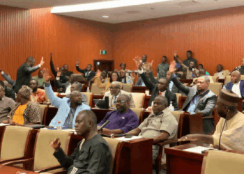 Members of Liberia’s House of Representatives vote during a plenary session to approve a comprehensive audit by the General Auditing Commission (GAC) at the Capitol.