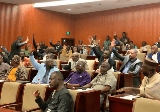 Members of Liberia’s House of Representatives vote during a plenary session to approve a comprehensive audit by the General Auditing Commission (GAC) at the Capitol.