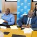 Finance Minister Augustine Kpehe Ngafuan and LEC Managing Director Mohammed M. Sherif sign a landmark solar power agreement with Scatec and IFC in Washington, D.C.