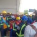 MVTC graduates in helmets and protective gear protesting during the 4th Circle Graduation in Monrovia over missing souvenirs and poor planning