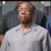Liberia’s former Justice Minister Frank Musa Dean stands outside the Temple of Justice after the Supreme Court lifts a stay on his arrest in the $11.5M ‘missing diamond’ case.