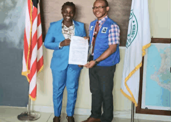Officials from NPHIL and the Ministry of National Defense sign an MOU in Monrovia to strengthen Liberia’s public health security and epidemic preparedness